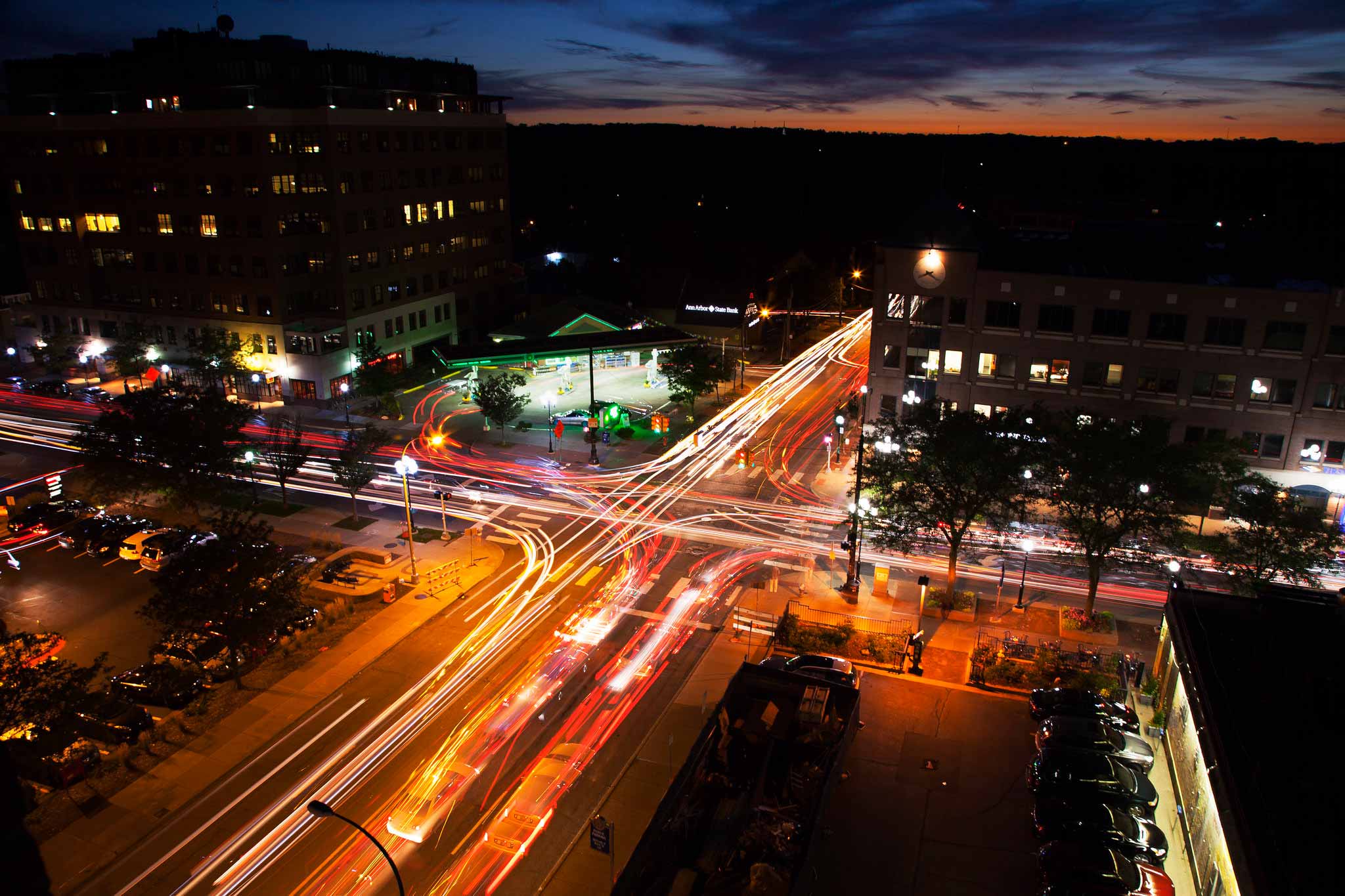night time aerial view of downtown Ann Arbor intersection. Campus buildings can be found throughout the downtown.