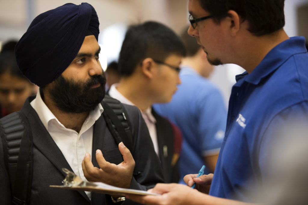 student speaks to career representative