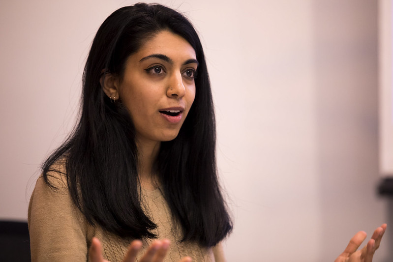 female student speaking at a podium
