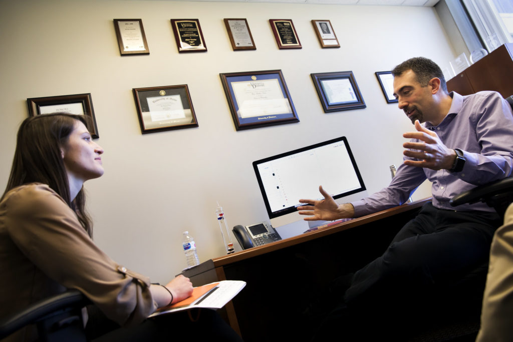 professor meeting with a prospective graduate student