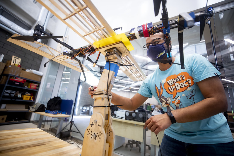 student in the ford robotics building in the lab