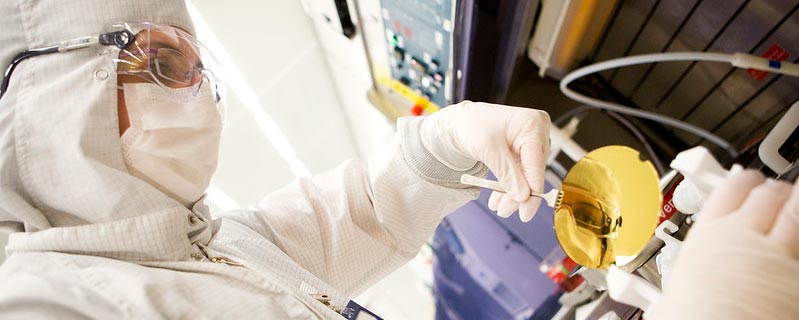 researcher wearing PPE works in the lab at the lure nanofabrication facility