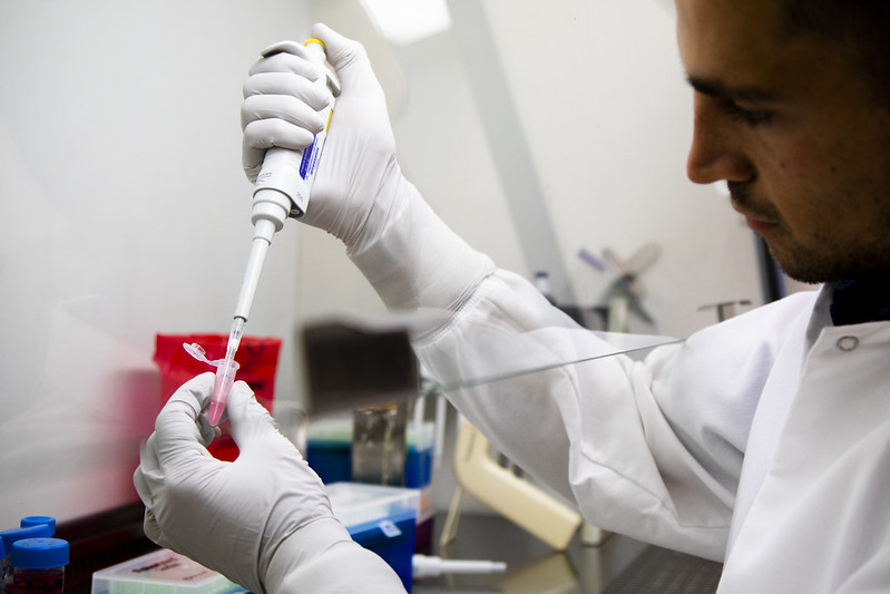 researcher holding scientific instrument