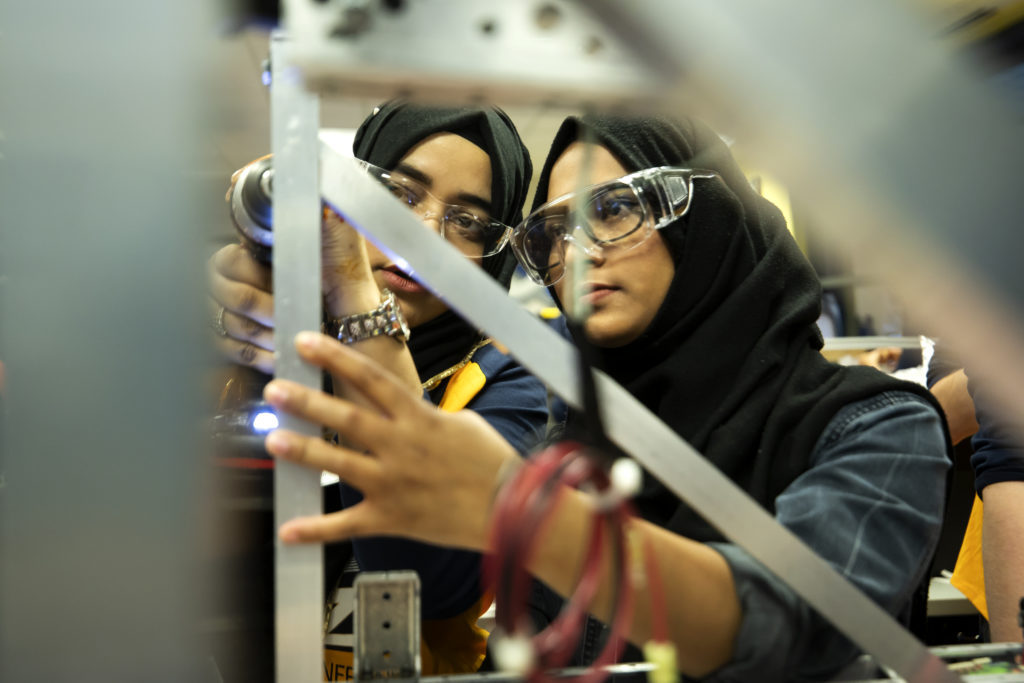 Zannatun Alim and Fabiha Khan work on their team's robot during an open house in the Michigan Engineering Zone (MEZ) in 2019. Photo: Joseph Xu/Michigan Engineering, Communications & Marketing