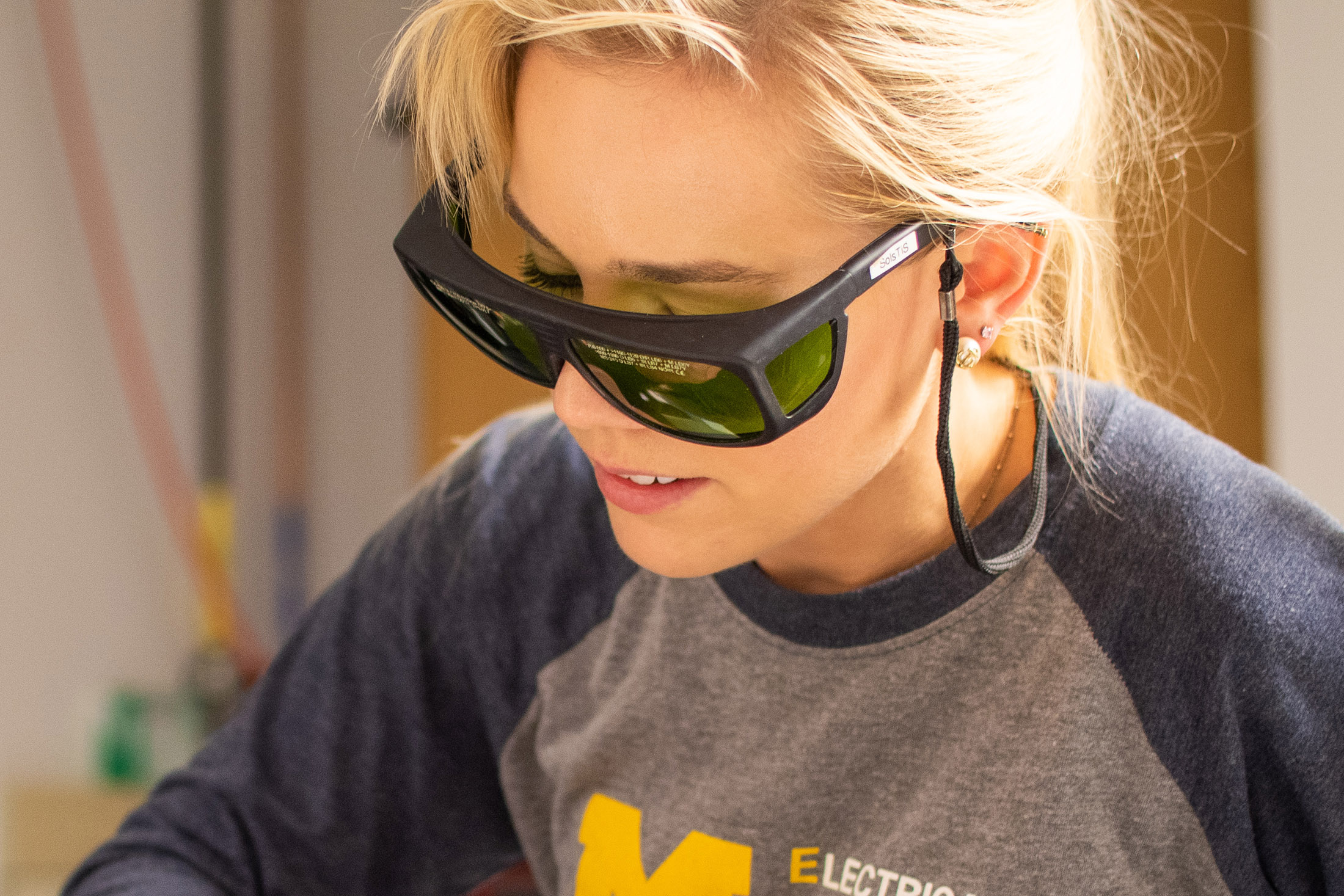 female scientist wearing eye protection