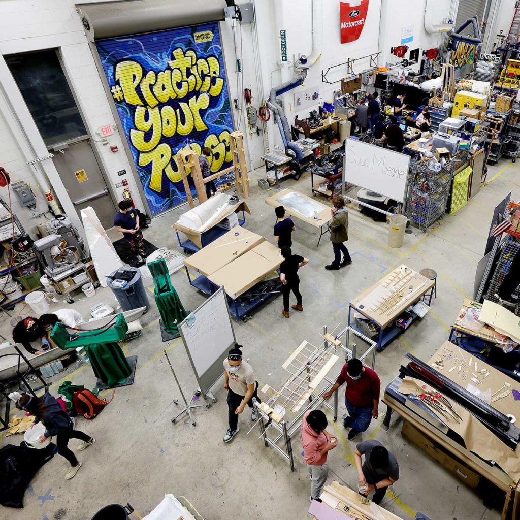 Overhead view of students working on various projects in the Wilson Student Team Project Center