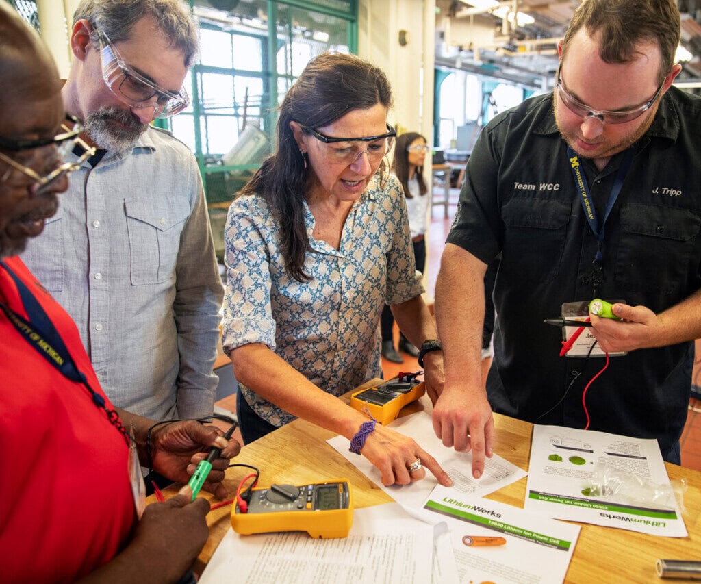 A researcher collaborates on battery designs
