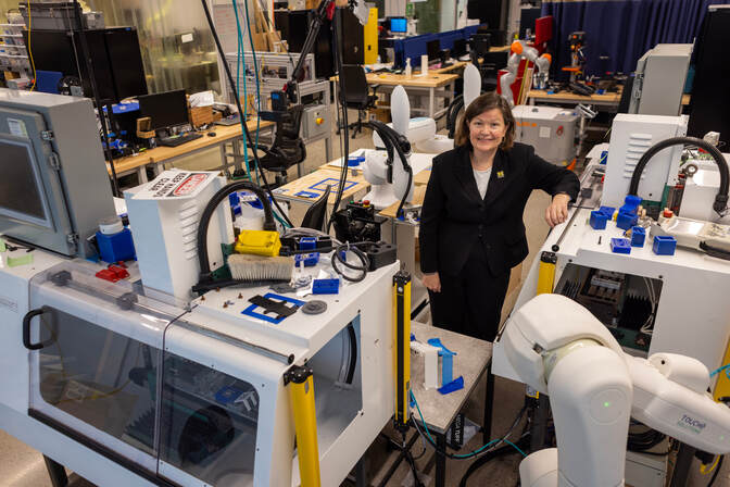 Dawn Tilbury poses in the robotics lab.